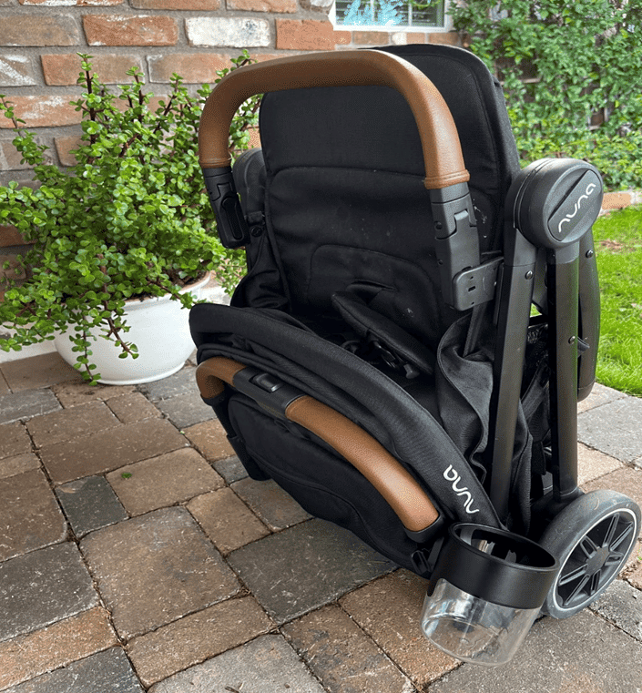 Folded Nuna TRVL with Nuna Cup Holder Attached