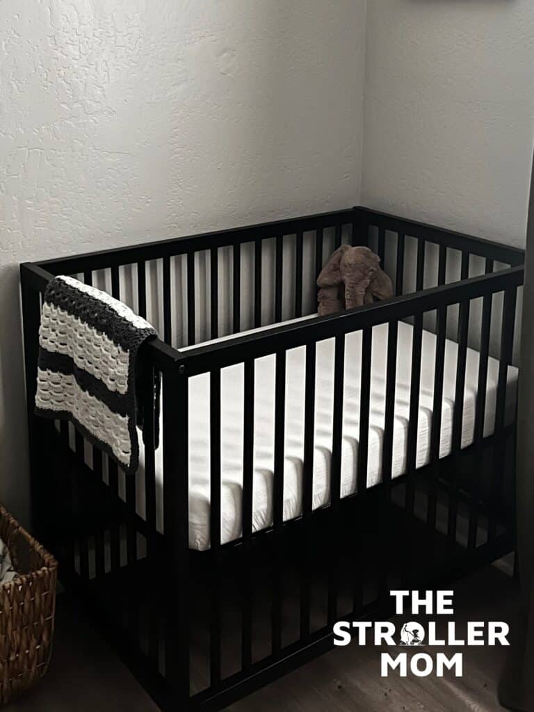 Graco mini crib in bedroom