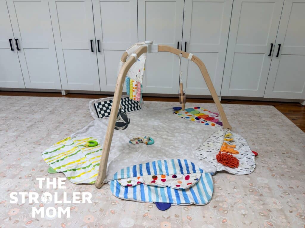 Lovevery play gym with developmental zones and hanging toys