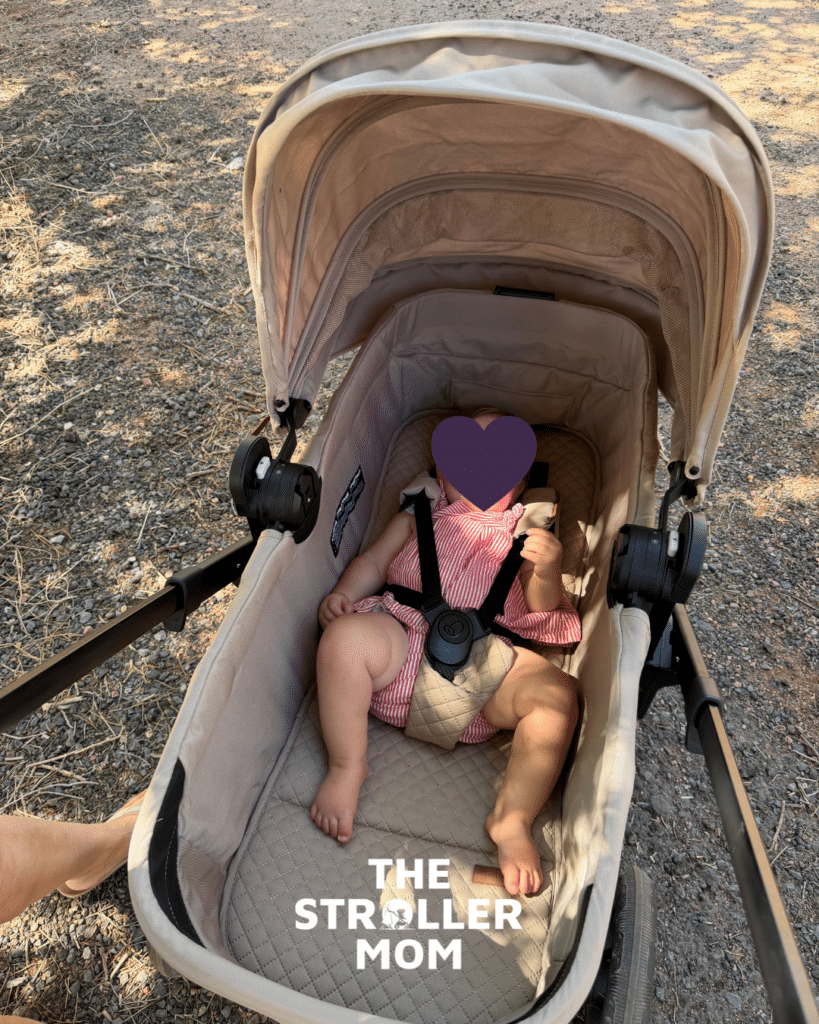 Evenflo Transformer in pramette mode with a baby in the seat