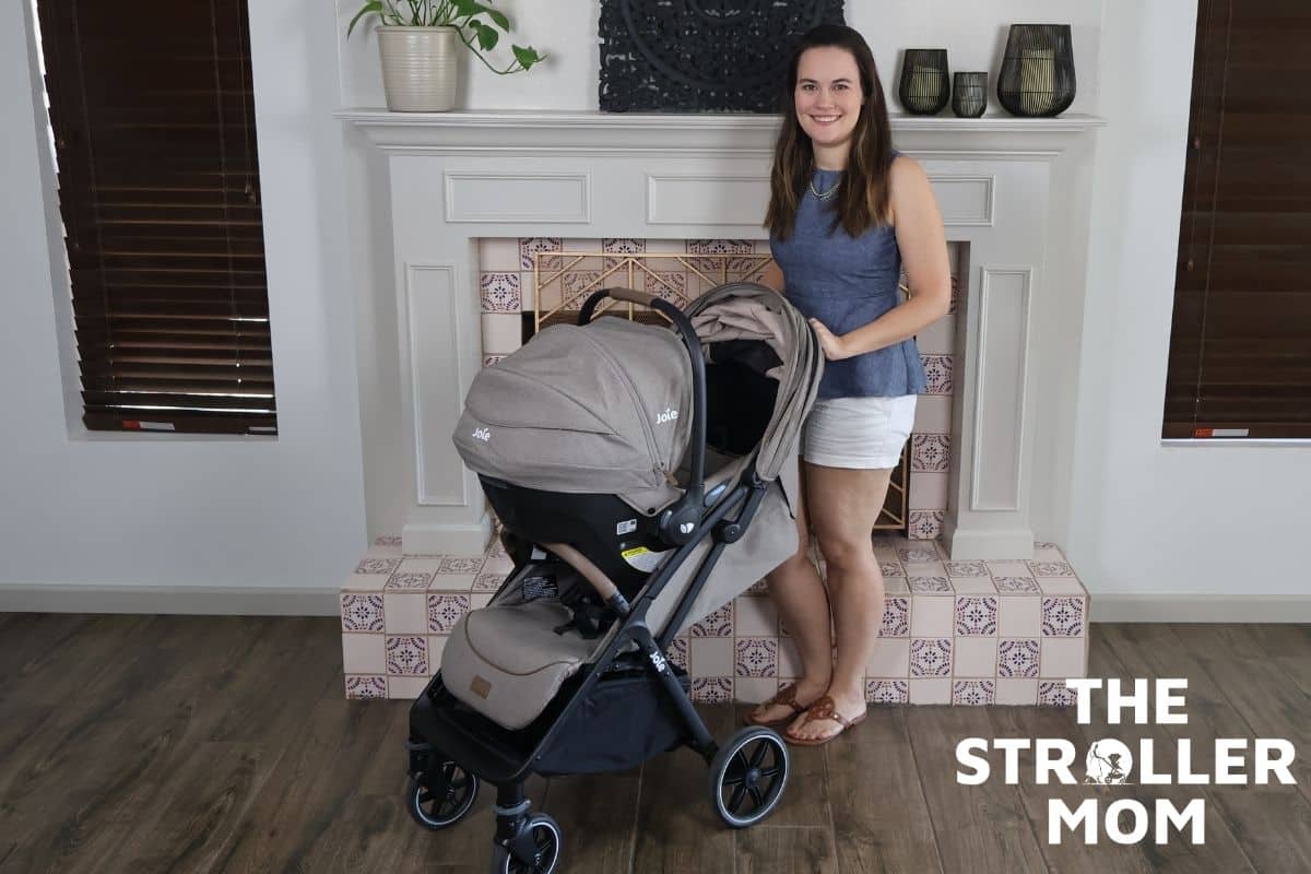 Emily standing beside the Joie Nutmeg stroller and Mint Latch infant car seat