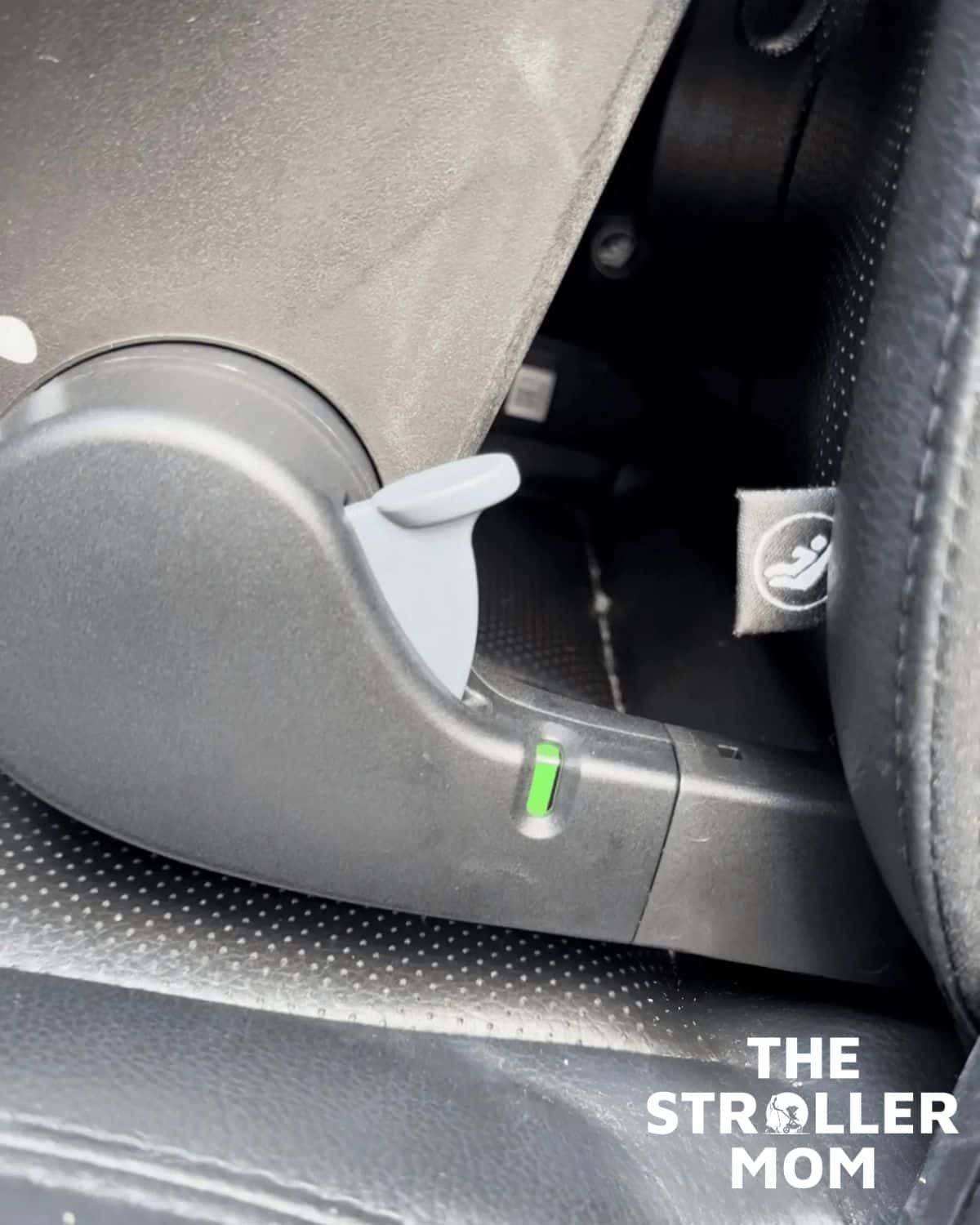 Joie Mint Latch baseless installation with the lock-off indicator showing green