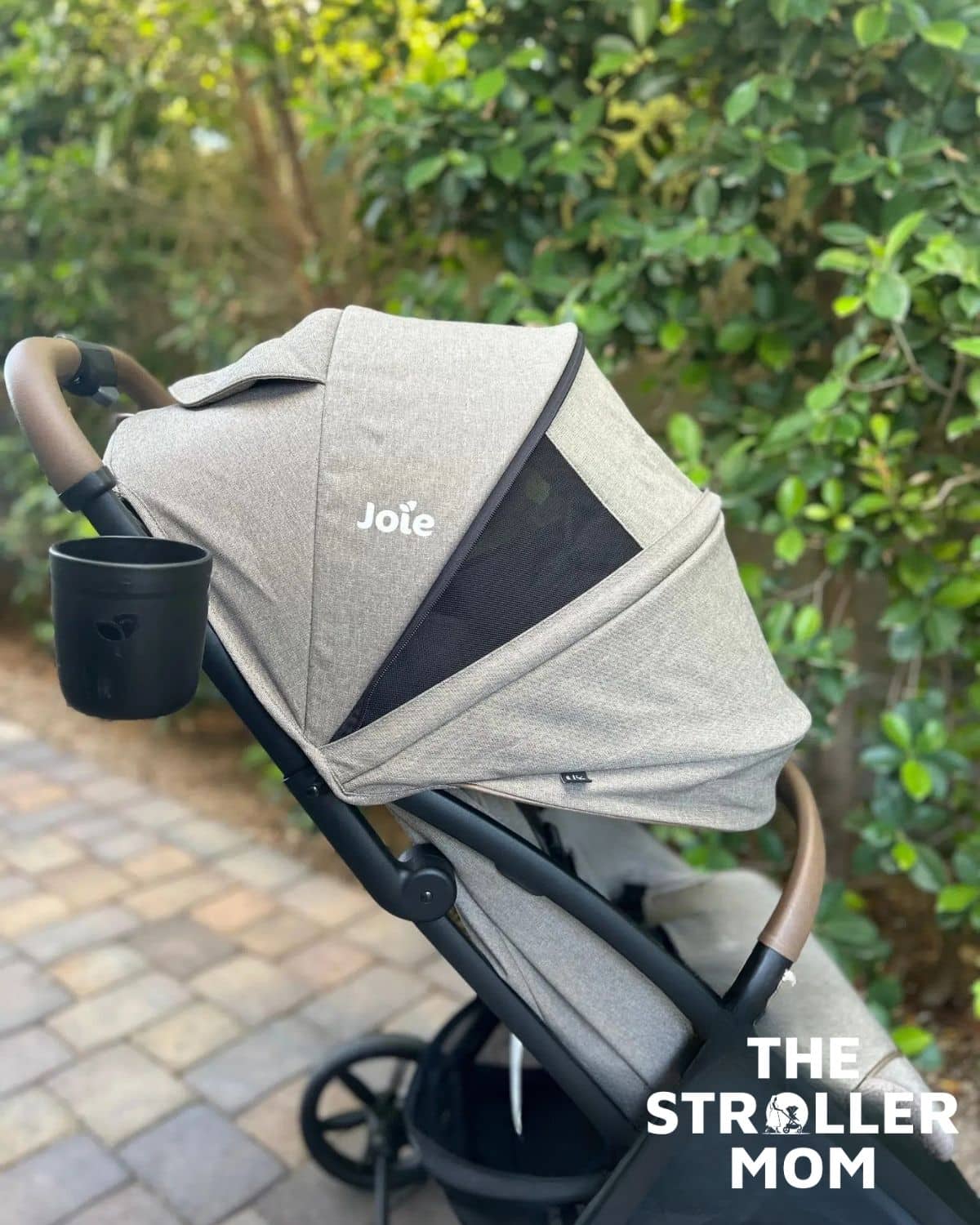 Joie Nutmeg canopy extended with the mesh vent open, side view