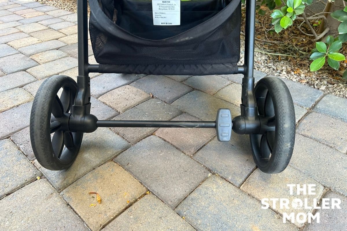 Joie Nutmeg rear wheels and foot brake bar, close-up