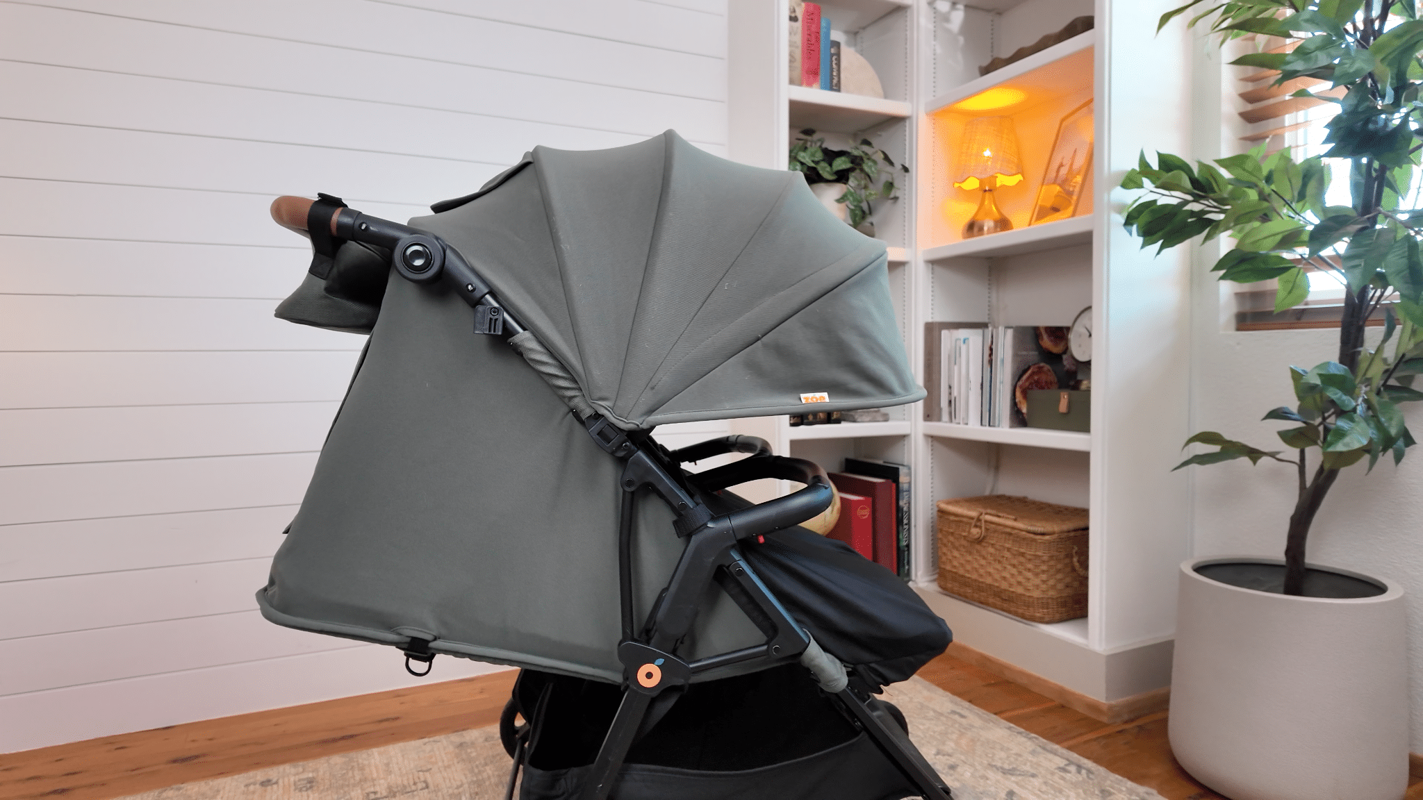 Side view of the Zoe Twin V3 with the seat reclined and canopy extended.